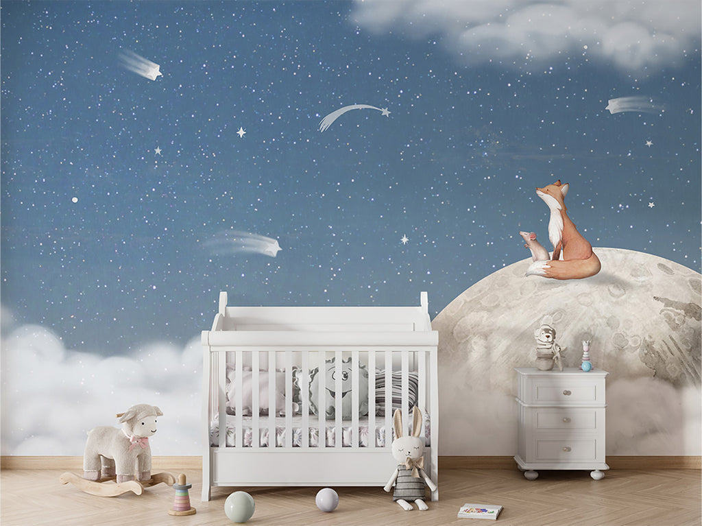 The room is enhanced by Fox on the Moon, Mural Wallpaper in Blue depicting a fox sitting on the moon amidst a starry night sky. This element adds a touch of fantasy and imagination to the room’s ambiance. The room appears to be well-lit, suggesting a warm and inviting space. The toys in the room are waiting for their next adventure, adding to the room’s playful and imaginative theme