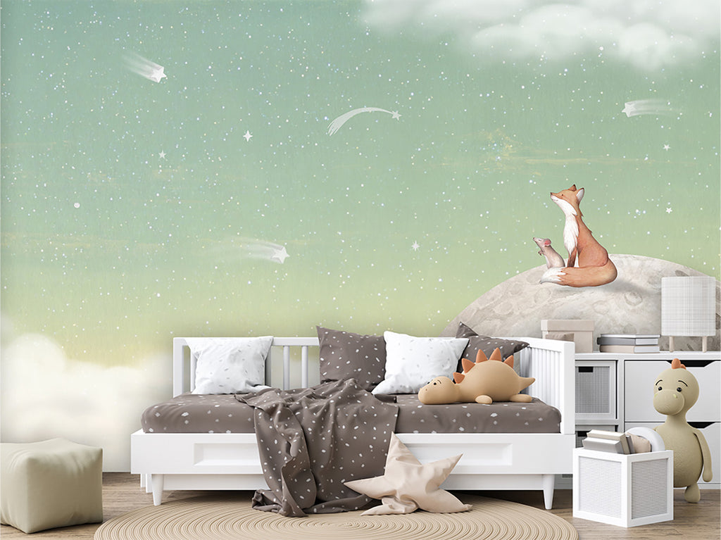 A captivating bedroom scene featuring the Fox on the Moon, Mural Wallpaper in Green. The mural depicts a whimsical fox sitting atop a moon amidst a starry sky and fluffy clouds, creating an enchanting atmosphere in the room. the bedroom has a white framed bed with white, and brown sheets and pillows, and is surrounded by plush animals and toys. 