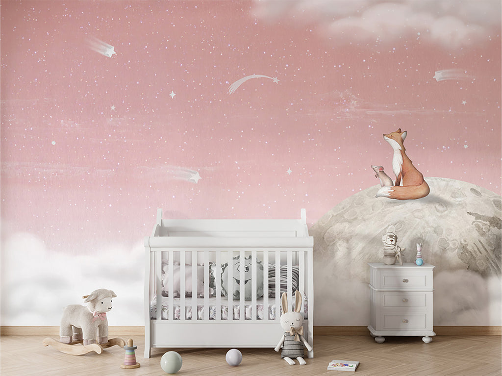 The room is enhanced by Fox on the Moon, Mural Wallpaper in Pink depicting a fox sitting on the moon amidst a starry night sky. This element adds a touch of fantasy and imagination to the room’s ambiance. The room appears to be well-lit, suggesting a warm and inviting space. The toys in the room are waiting for their next adventure, adding to the room’s playful and imaginative theme