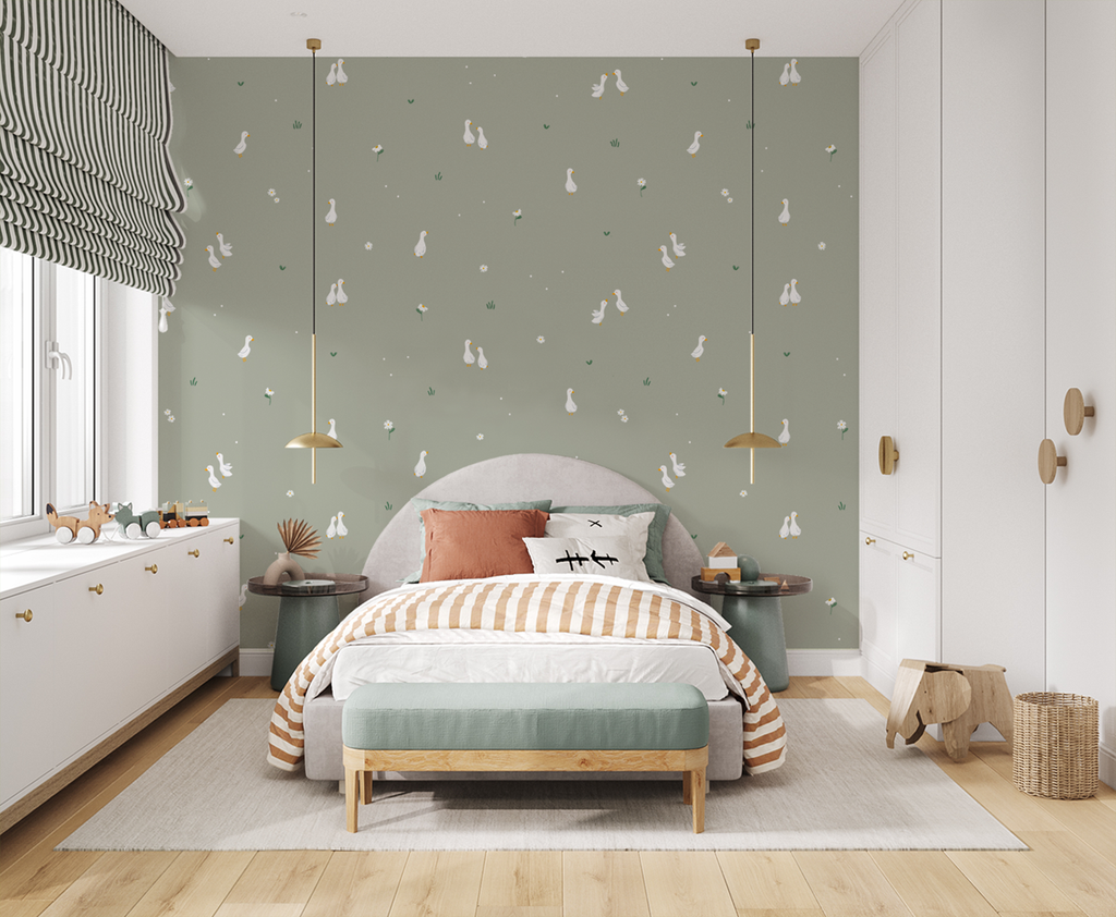 Bedroom with green Graceful Geese wallpaper, gray bed, striped bedding, pendant lights, wooden accents, and playful decor.