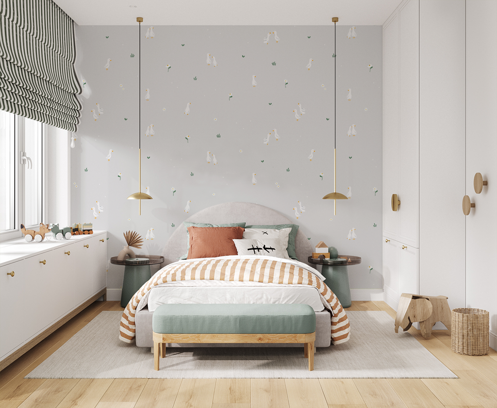 Bedroom with grey Graceful Geese wallpaper, gray bed, striped bedding, pendant lights, wooden accents, and playful decor.