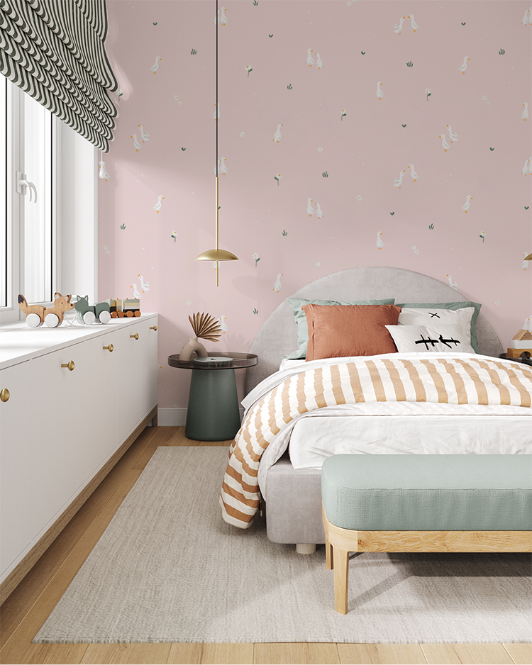 Bedroom with pink Graceful Geese wallpaper, gray bed, striped bedding, pendant lights, wooden accents, and playful decor.