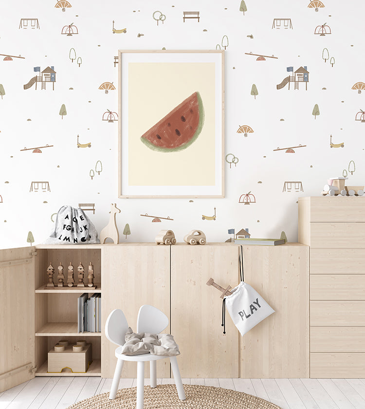A vibrant children’s room featuring the Mini Fruitful Play, Pattern Wallpaper in White. The room includes a blackboard, a wooden shelf with numbers, and a white desk with chairs, creating a playful and educational environment.