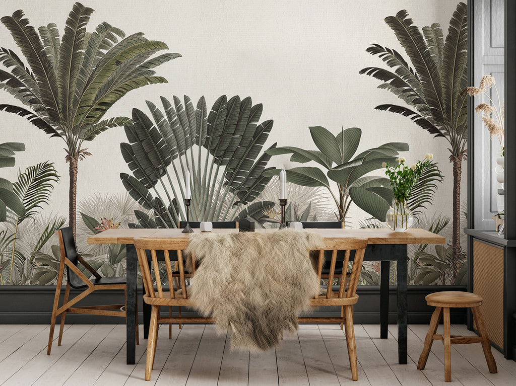 A stylish dining area is transformed into a tropical paradise with the Palm Paradise, Tropical Mural Wallpaper in Green. The wallpaper features a variety of palm tree species in lush shades of green, creating a serene and inviting atmosphere.