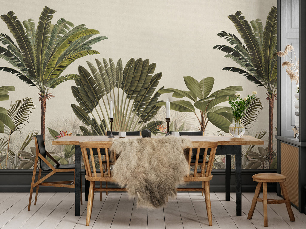 A stylish dining area is transformed into a tropical paradise with the Palm Paradise, Tropical Mural Wallpaper in Honey. The wallpaper features a variety of palm tree species in shades of green, creating a serene and inviting atmosphere.