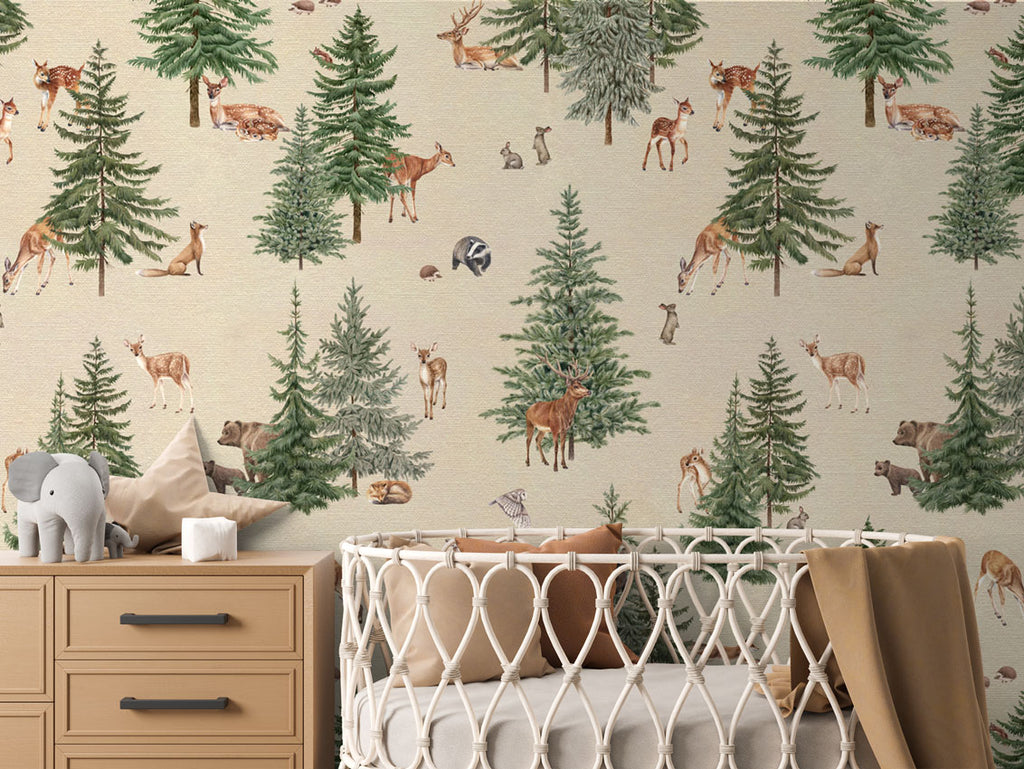 Pine forest, Pattern Wallpaper in sand colourway. The nursery room includes a wooden dresser with an elephant plush toy, and a crib with a brown blanket.
