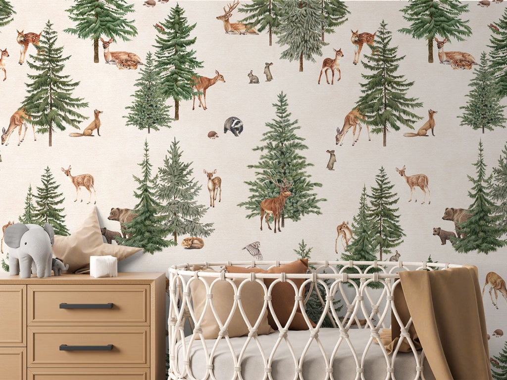 Pine forest, Pattern Wallpaper in white colourway. The nursery room includes a wooden dresser with an elephant plush toy, and a crib with a brown blanket.