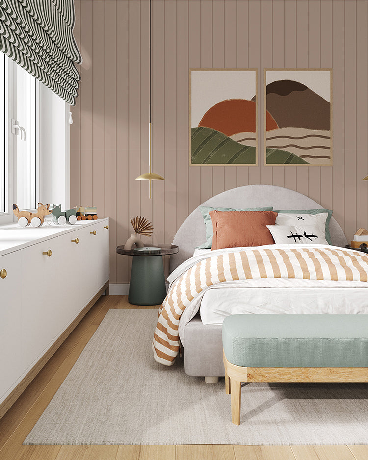Inviting bedroom adorned with Nude Shiplap, Vertical Striped Wallpaper. The room features a cozy bed with striped bedding, abstract wall art, a plush bench, and a dresser filled with toys, creating a harmonious and well-decorated space.