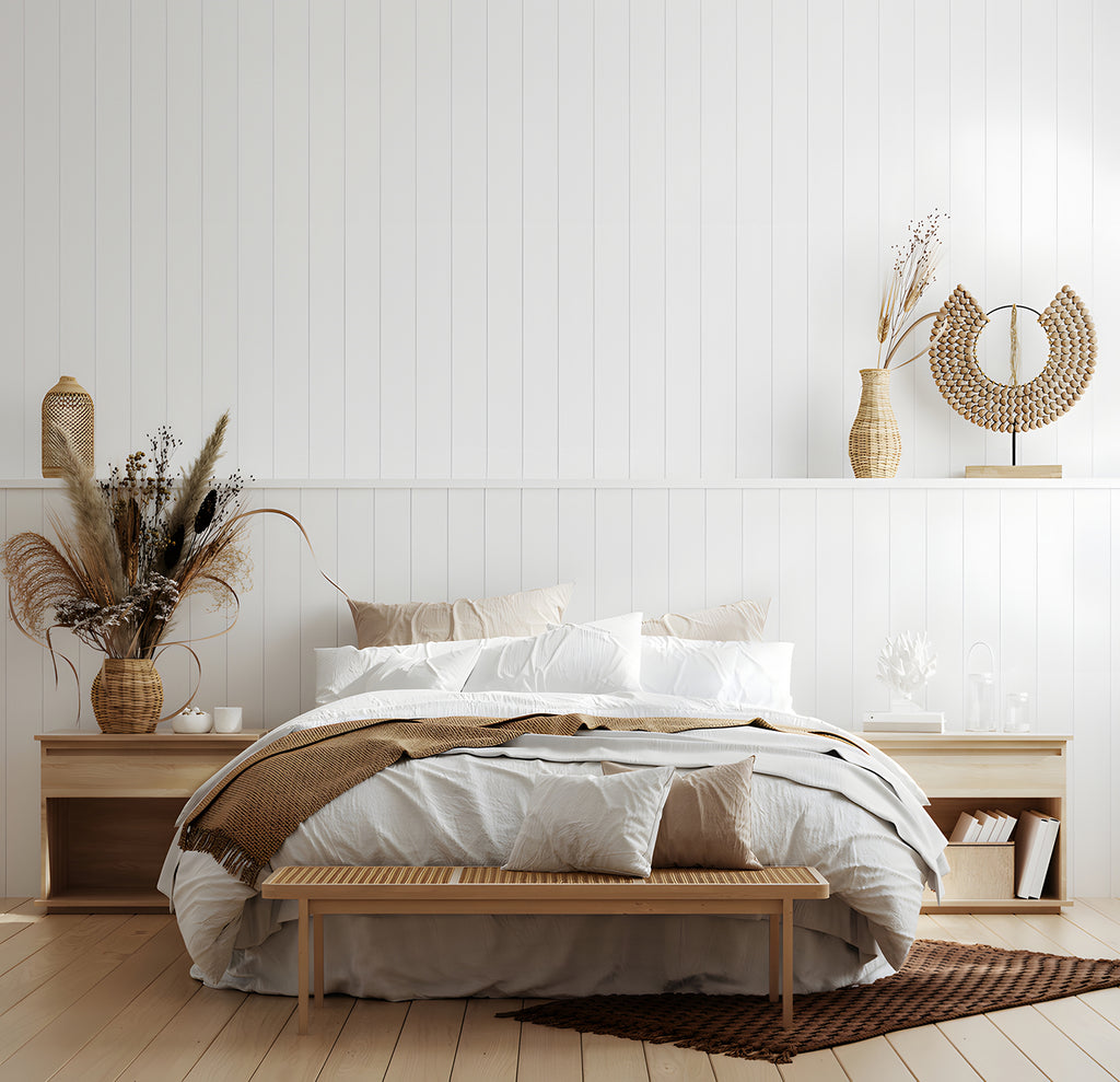 Inviting bedroom adorned with White Shiplap, Vertical Striped Wallpaper. The room features a cozy bed with striped bedding, abstract wall art, a plush bench, and a dresser filled with toys, creating a harmonious and well-decorated space.