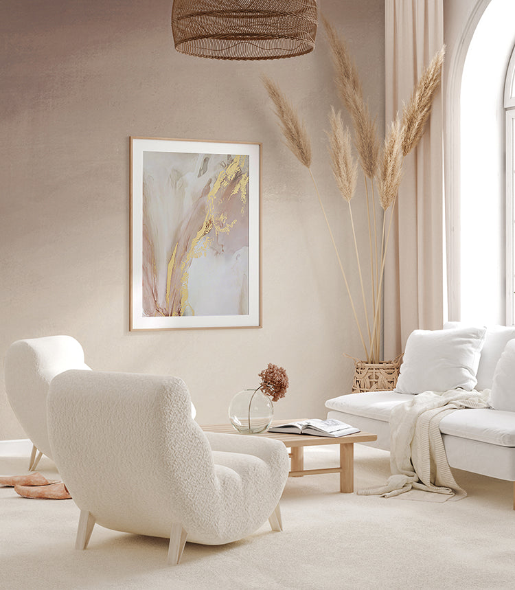 Serene room with plush white furniture, enhanced by the tranquil ambiance of the Stella Skies Ombre Wallpaper Blush Pink. Abstract art and pampas grass decor add to the room’s sophistication.