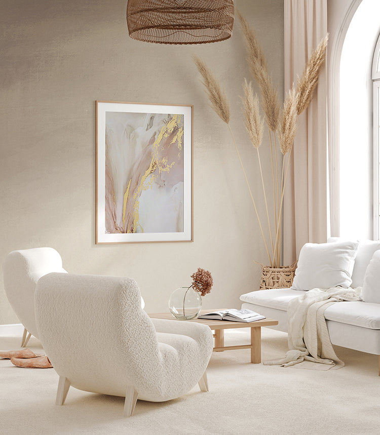 Serene room with plush white furniture, enhanced by the tranquil ambiance of the Stella Skies Ombre Wallpaper Sand. Abstract art and pampas grass decor add to the room’s sophistication.