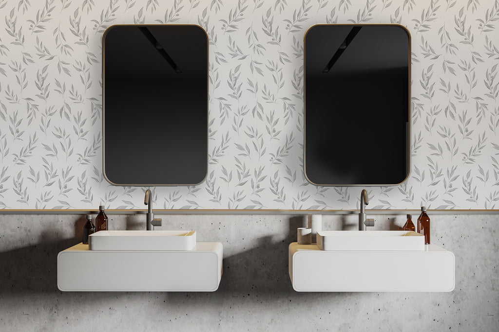 Modern bathroom with two rectangular vessel sinks and square mirrors, set against the Watercolour Foliage by Olivia, Pattern Wallpaper in Grey. The room’s clean lines and neutral tones highlight the subtle elegance of the design.