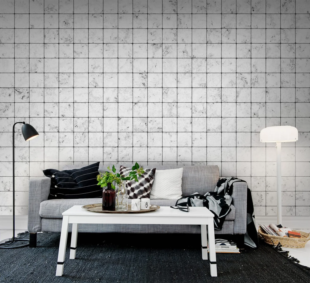 Marble Tiles, Pattern Wallpaper featured on a wall of a living area with grey sofa and multiple colored pillows and white table