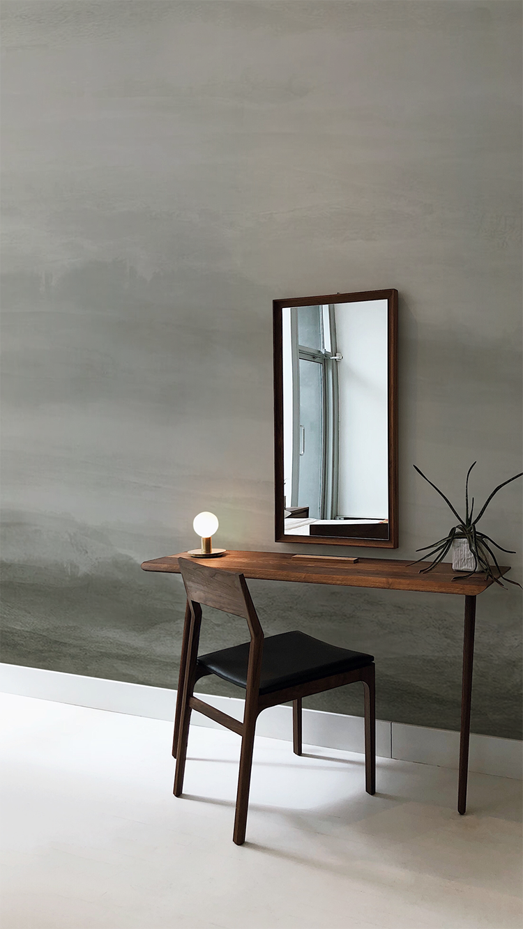 Vista, Watercolor Ombre Wallpaper in Stratos Grey colourway, featured on a wall in a vanity room