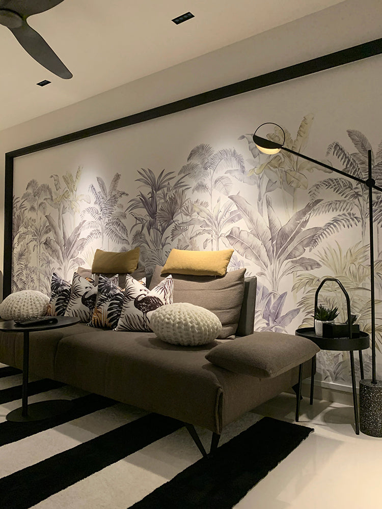 Palm Garden, Tropical Mural Wallpaper in a living area, featuring various palm designs, bathed in serene cool grey and joyful yellow hues