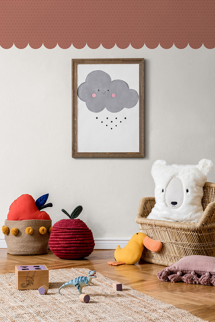 A vibrant children’s playroom filled with an array of colorful toys and educational games. The room is adorned with whimsical art pieces that echo the playful energy of the room. The stylish Scallops Trimmings wallpaper in Brandy enhances the inviting atmosphere.