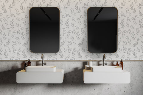 Modern bathroom with two rectangular vessel sinks and square mirrors, set against the Watercolour Foliage by Olivia, Pattern Wallpaper in Grey. The room’s clean lines and neutral tones highlight the subtle elegance of the design.