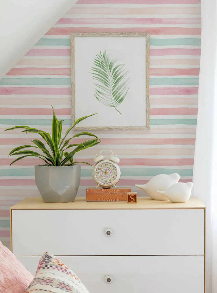 Coral Mint Stripes Wallpaper in bedroom with framed art on shelf