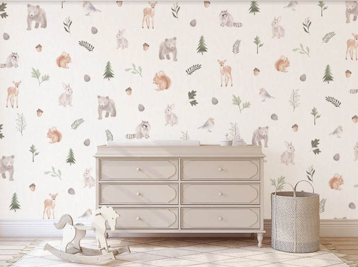 Patterned wallpaper features adorable woodland creatures, pine trees and acorns in kid's bedroom