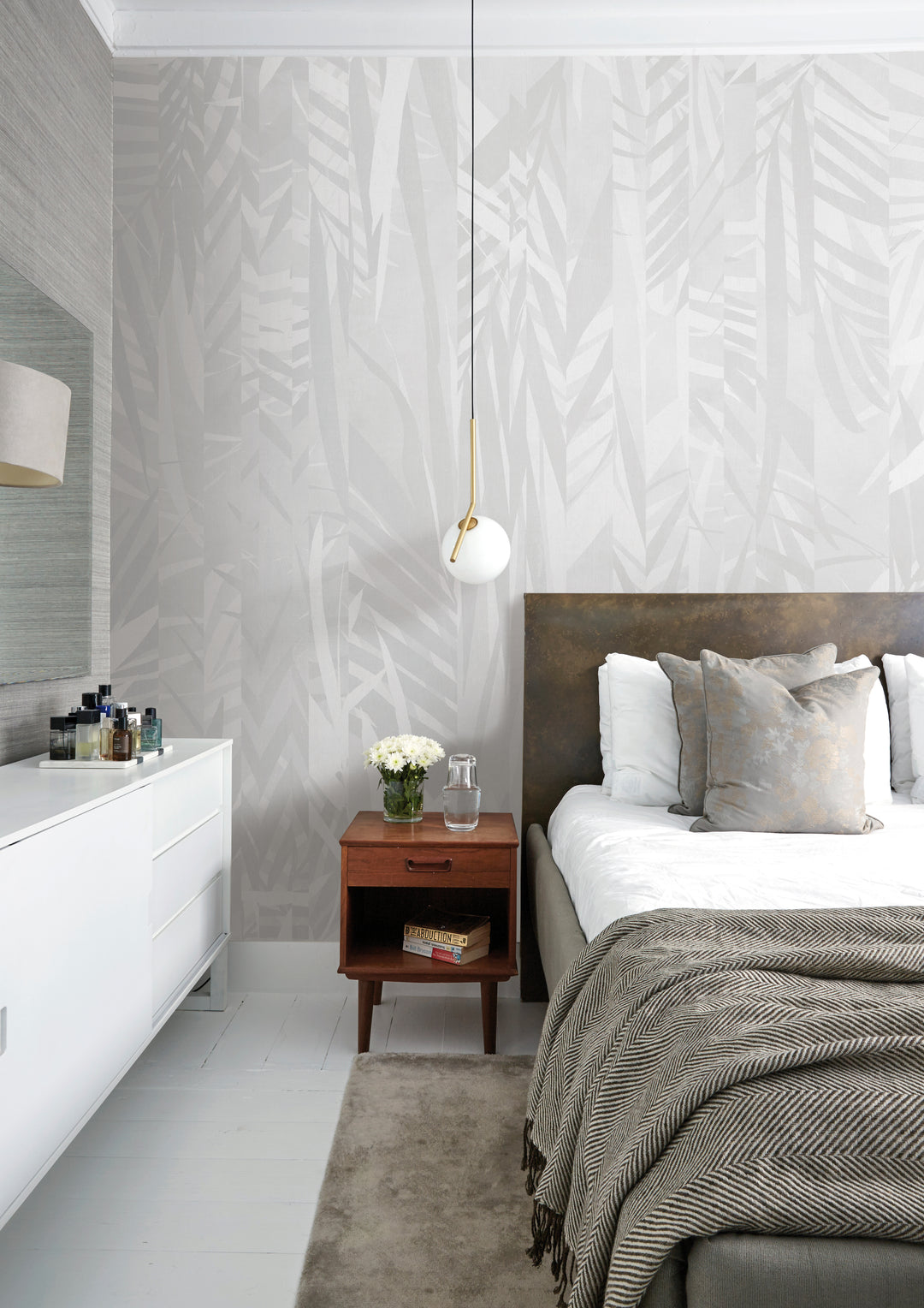 earthy-toned foliage wallpaper in bedroom
