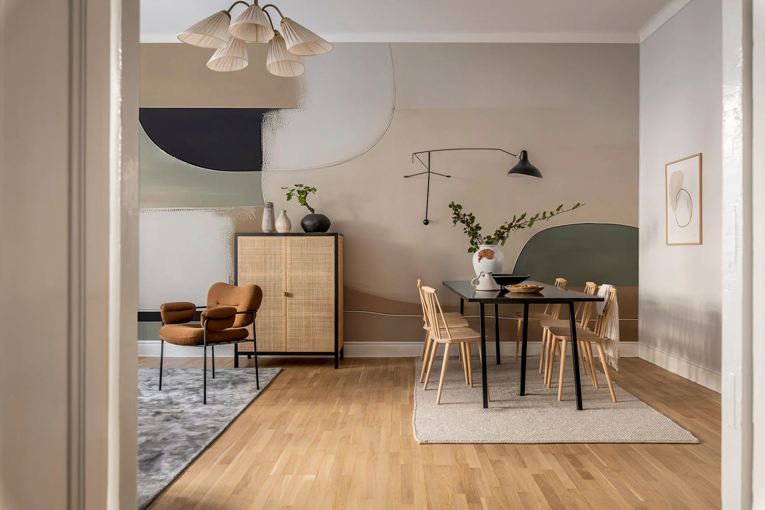 Rina Abstract Shapes, Faux Texture Wallpaper featured in a wall of a dining area, with rattan chairs and black table with dishes and plant vase on top