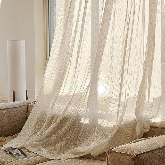 Ivory white sheer curtain with airy flow in a mediterranean living room