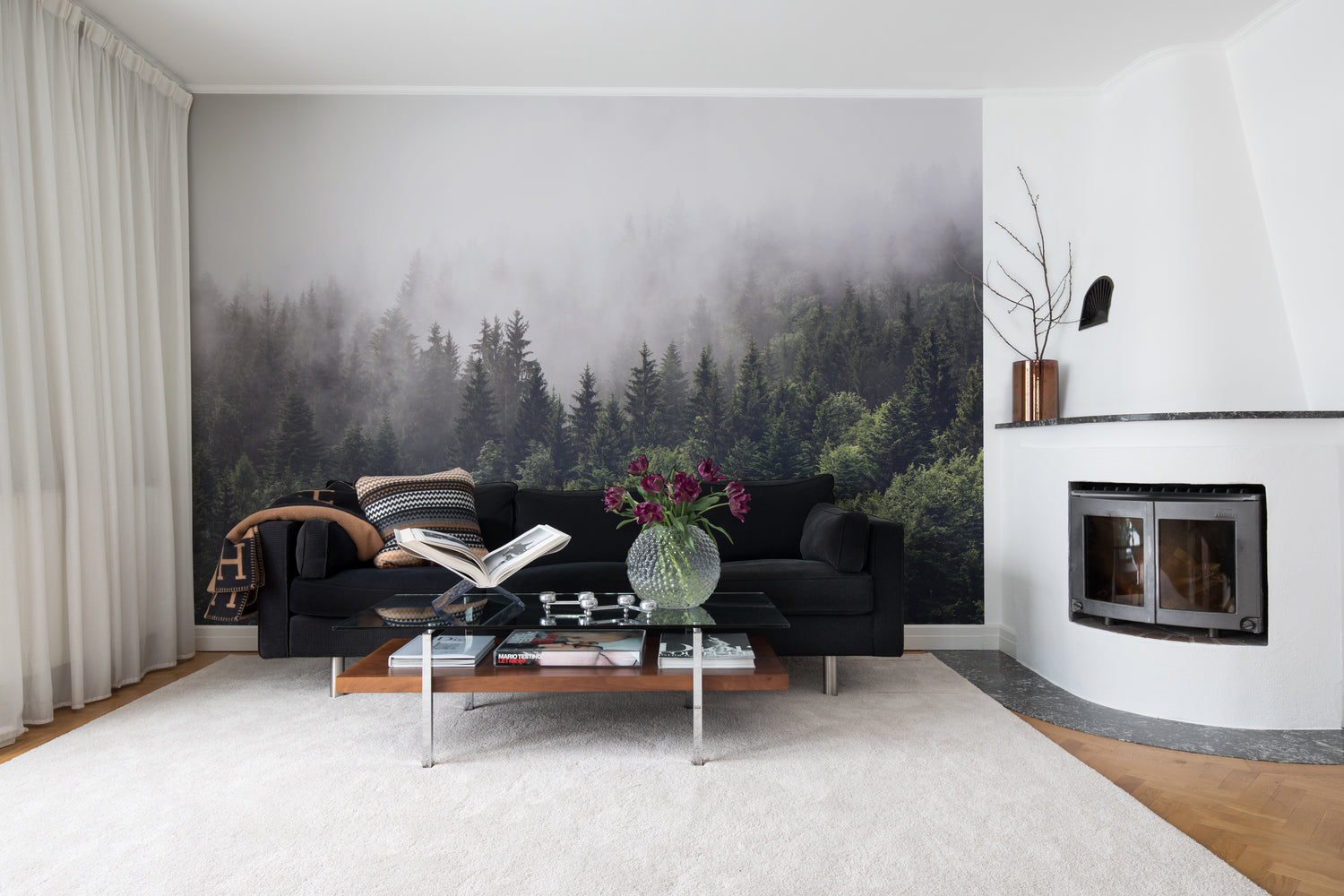 HC-Misty_Fir_Woods_Landscape_Mural_Wallpaper-Interior1-1812023.jpg Misty Fir Woods, Landscape Mural Wallpaper, featured in a living area, with a color palette of black and white.
