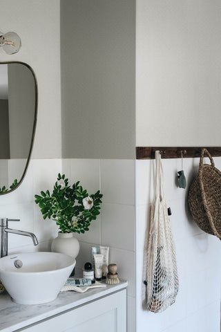 Small patterned wallpaper in dusky blue in bathroom