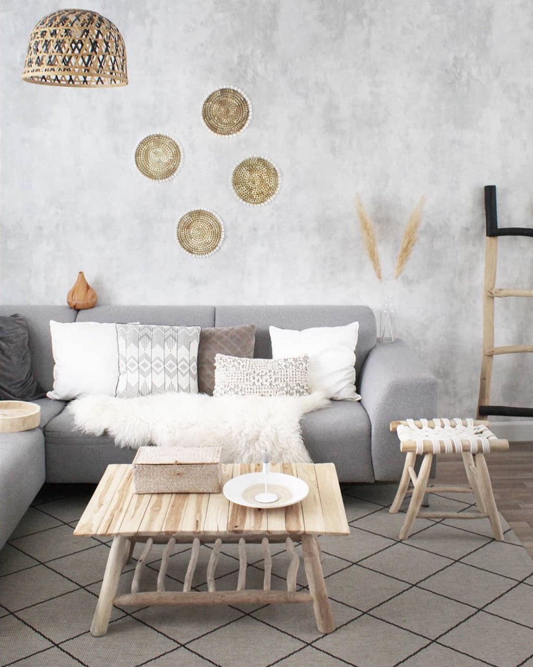 Fresco, Grey Faux Texture Wallpaper installed in a living room decorated with grey linen sofa and bohemian decorations
