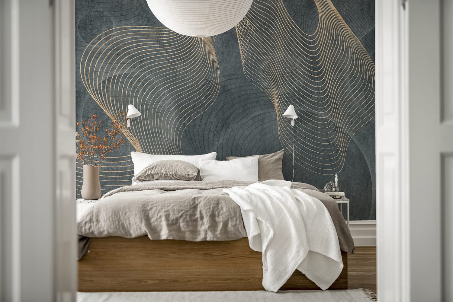 Affluence, Sapphire Faux Texture Wallpaper featured on a wall of a bedroom with a dirty white sheets and a white throw blanket.