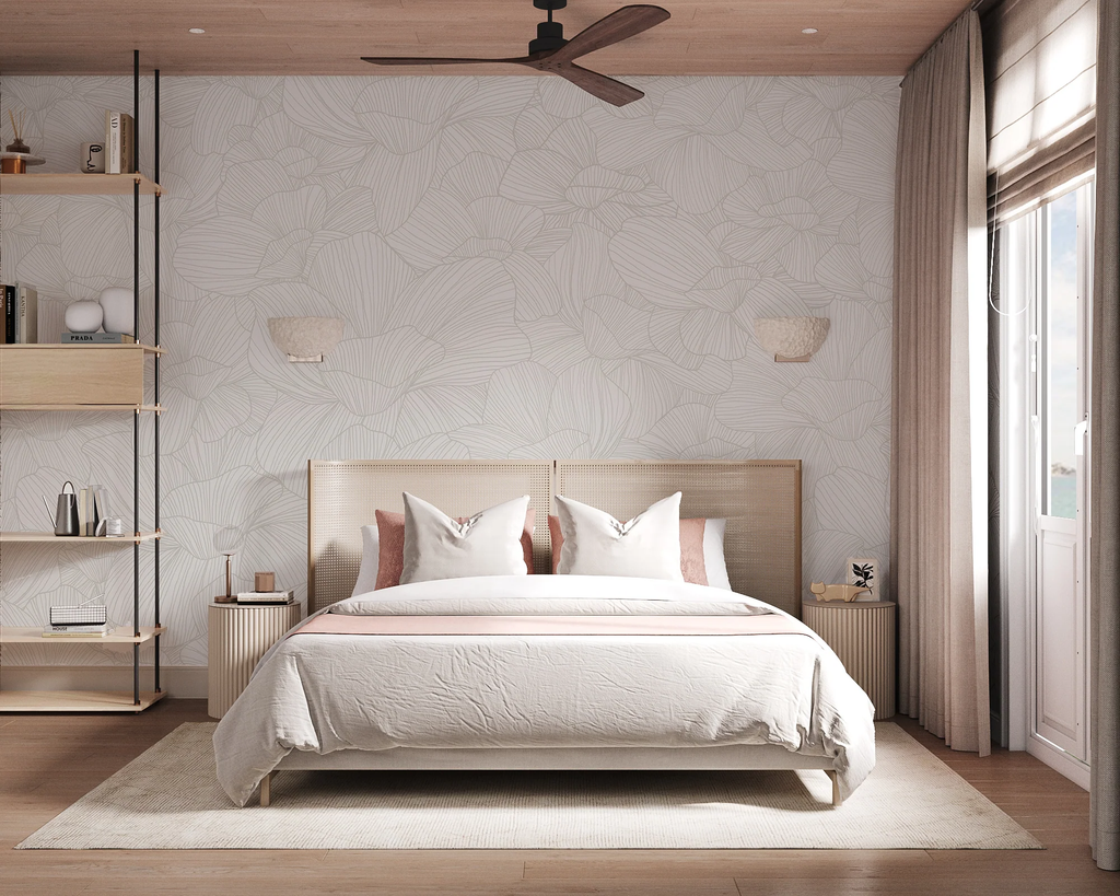 Serene bedroom with Saltwater Blooms, Pattern Wallpaper in Grey. Features include a cozy double bed, wooden side tables, wall-mounted lamps, a ceiling fan, and a window with sheer curtains. The room exudes a warm, inviting atmosphere.