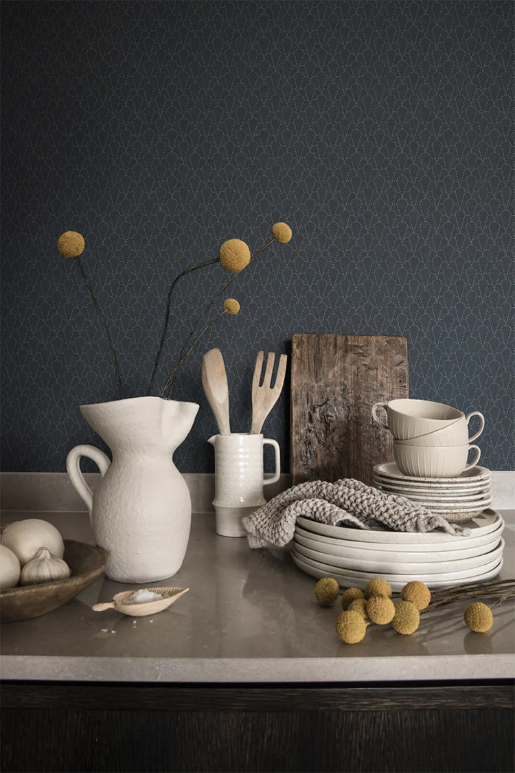 Sashi, Japanese geometric pattern wallpaper featured on a wall of a kitchen with a table with stacked plates and several kitchenwares on top