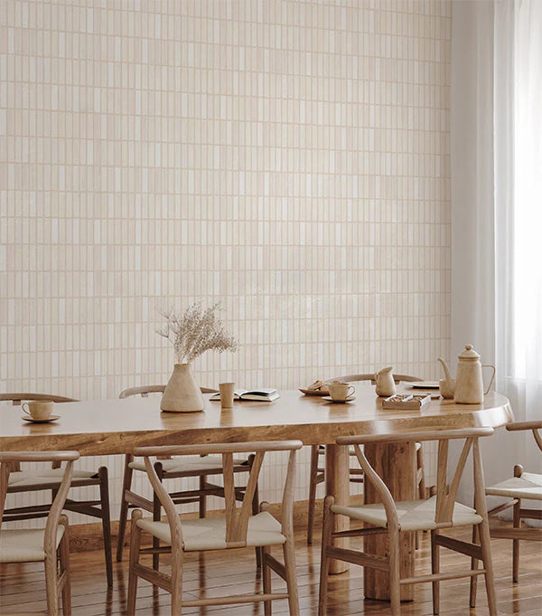 Terra tessel wallpaper in a mediterranean living room style decorated with light wooden furnitures