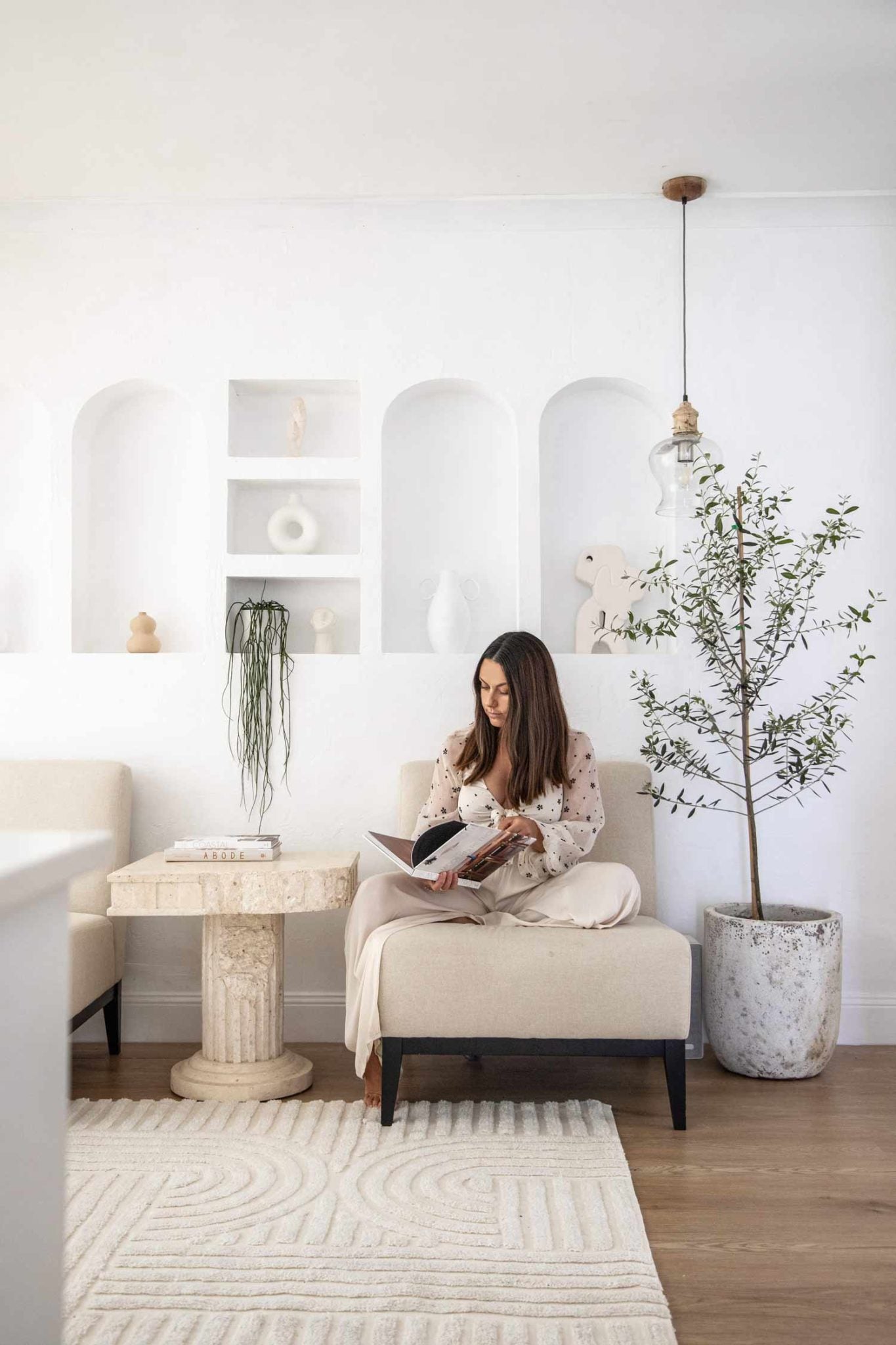Mediterranean reading nook decorated in rattan decorations and eucalyptus tree