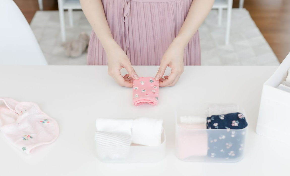 Esther is folding baby napkins